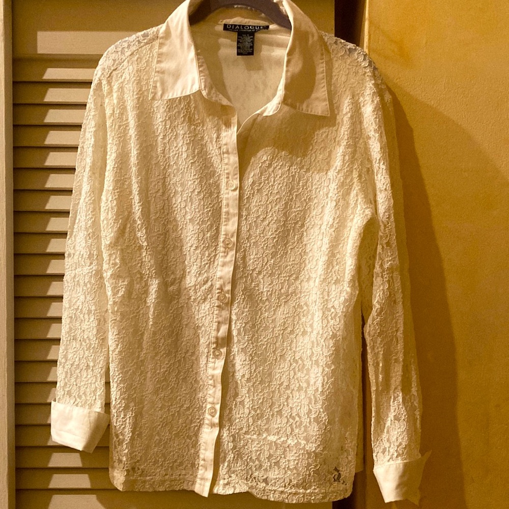 White/cream lace blouse with entire body lined and sleeves are not lined.